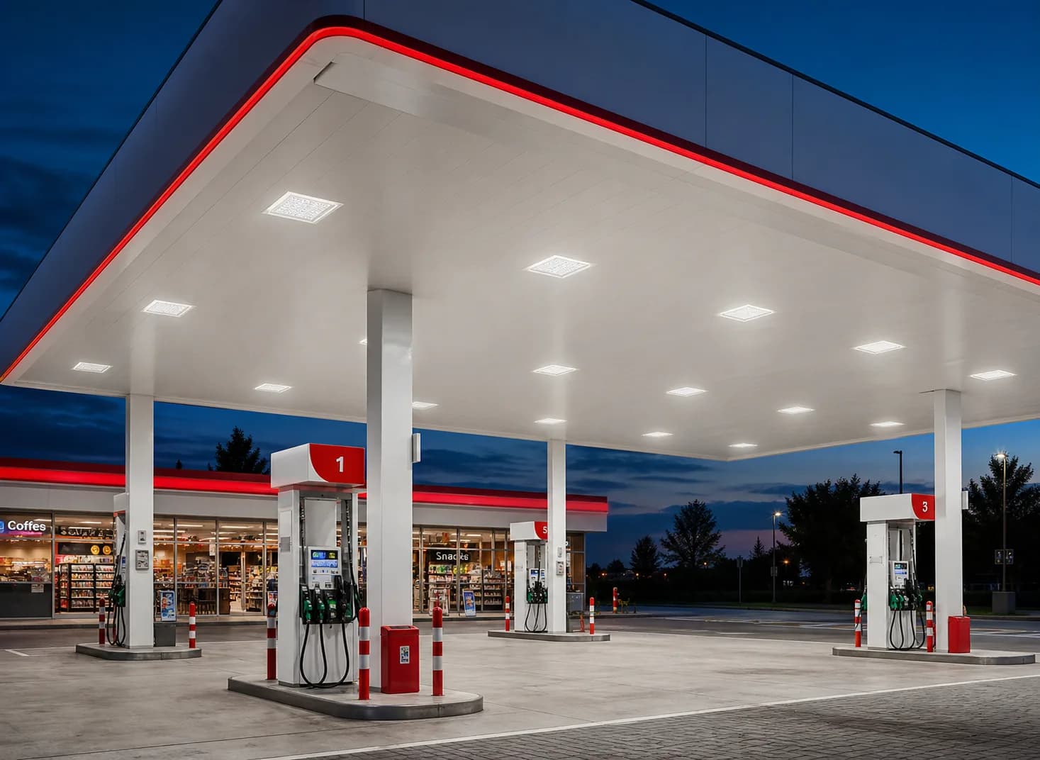 Explosion-proof canopy lights installed beneath a gas station canopy